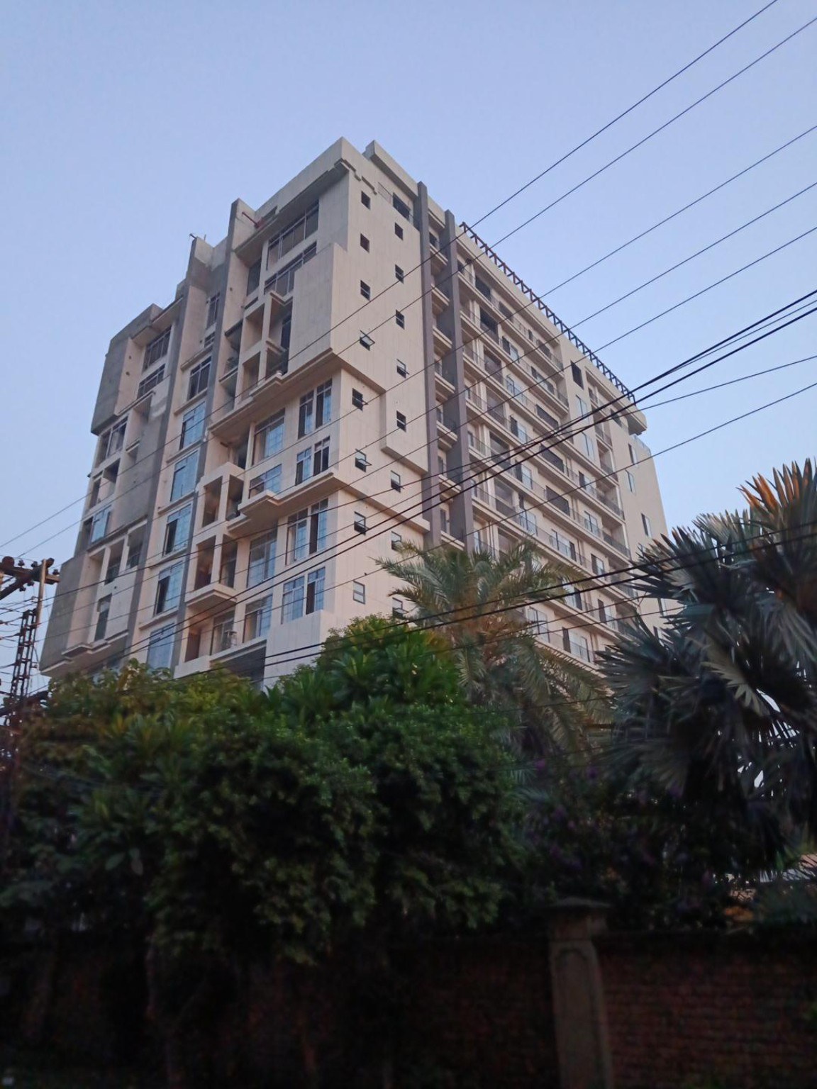 Tall apartment building with repeated balconies in Lahore
